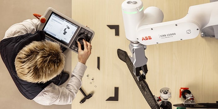 Technician programming a GoFa robot