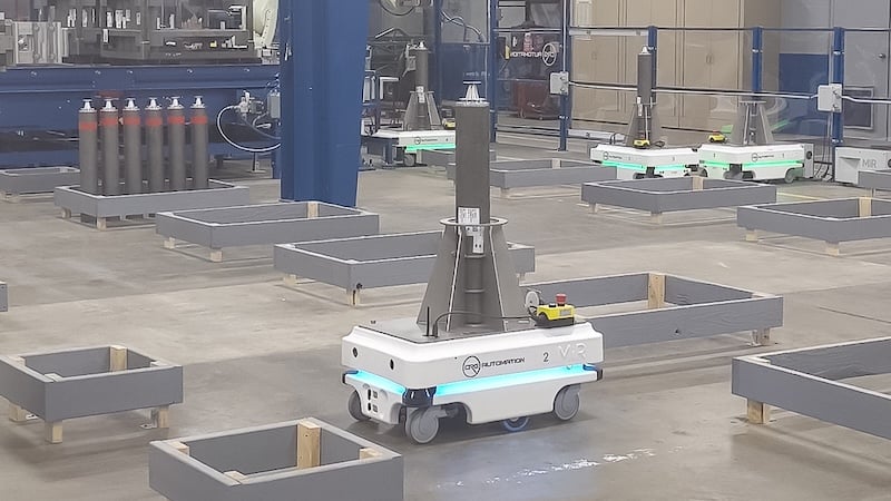 An autonomous mobile robot moving items through a physical space, which can be fitted with the new locating standard for better spatial awareness.