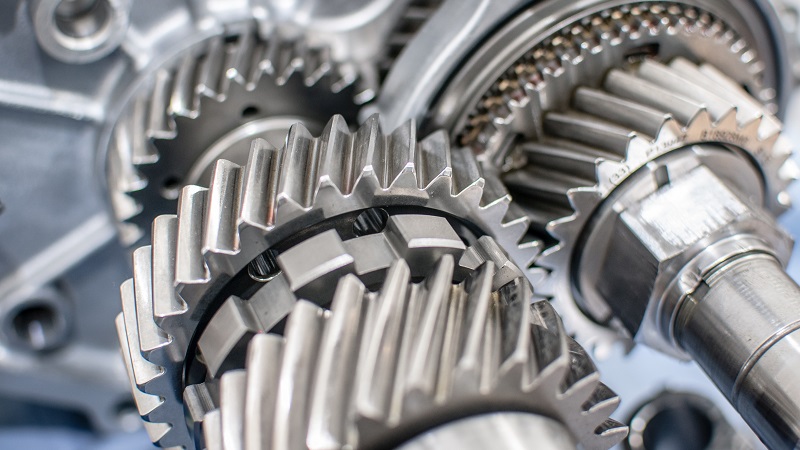 Transmission gears with a helix angle cut