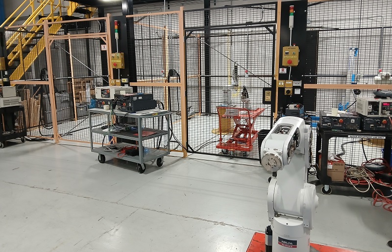 Robots in repair (front) and final test (back) stages of service