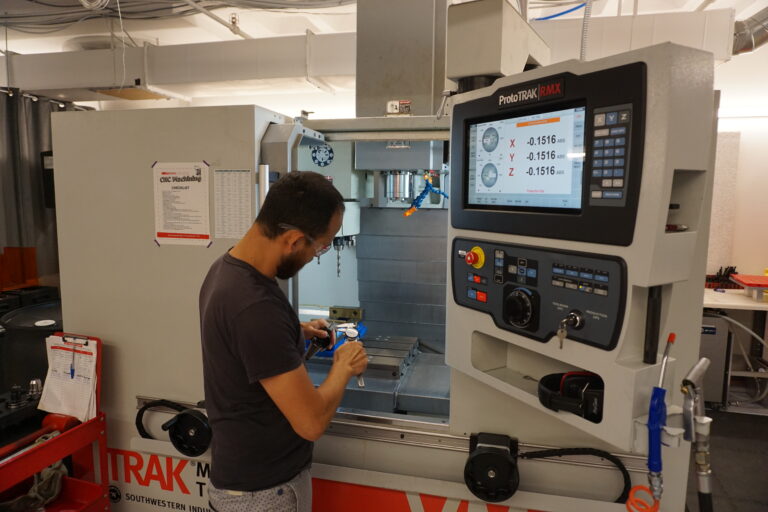 Physical AI fellows work through tooling challenges with their newly acquired skillsets
