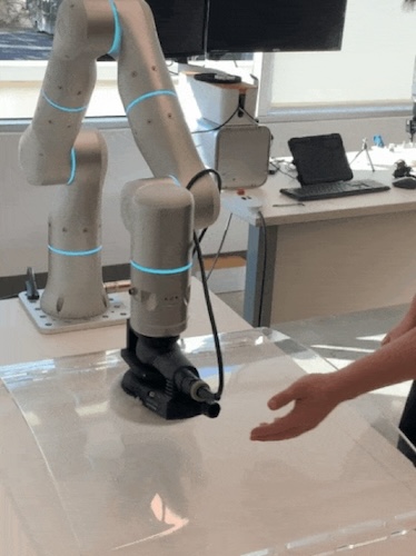 The Flexiv robot being used in a polishing application without any guarding.