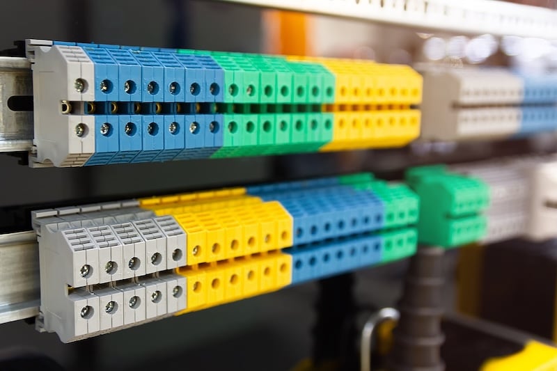A row of terminals mounted on DIN rail.
