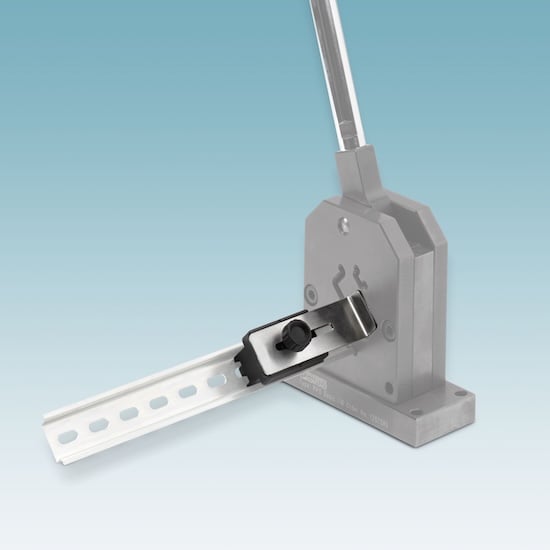 The Phoenix Contact Zero-Cut Block contains the block to specify spacing, the cutting lever, and multiple channels to accommodate different sizes of DIN rail.