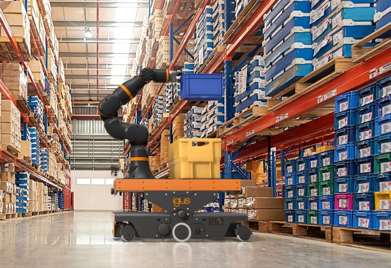 The ReBeL Move, equipped with an optional ReBeL cobot, moving bins around a storage area.