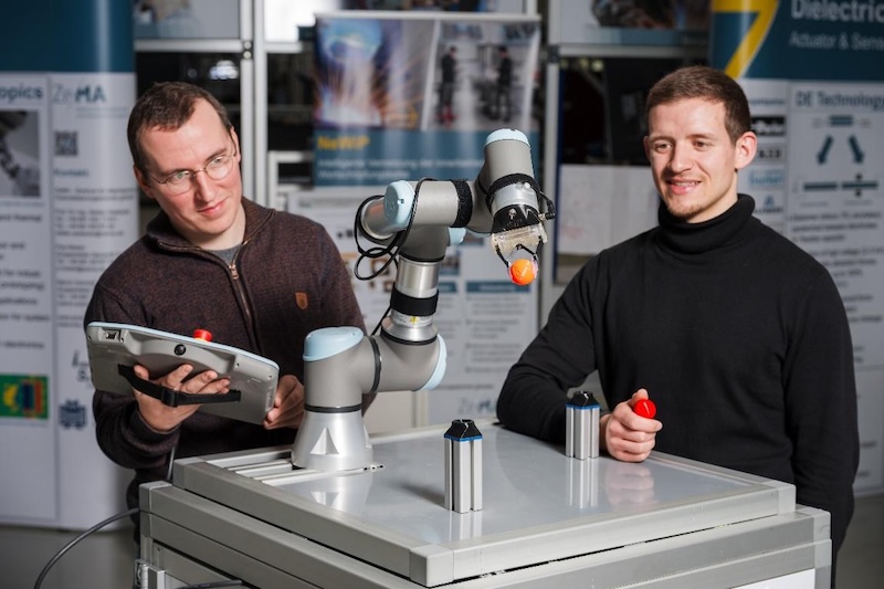 PhD research student Tom Gorges (left) and Master’s student Philipp Göddel (right) are part of the team developing the smart gripper technology for industrial applications.