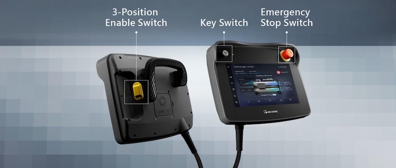 The cMT3106XM handheld HMI integrates triple-layer safety, a 3-position enable switch, a key switch for access control, and an emergency stop switch.